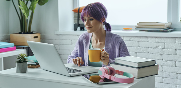 Woman reading information on a laptop
